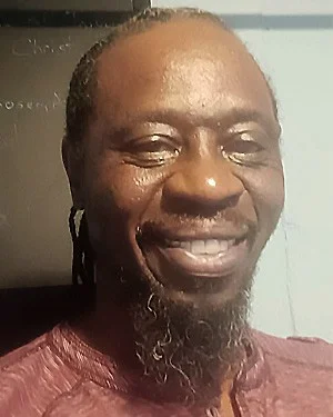 Tony Gardner, smiling.